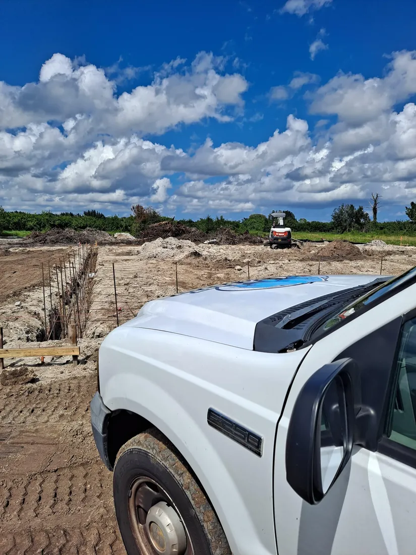 Licensed and insured Rhino Pest Management truck loaded with equipment in a Florida driveway